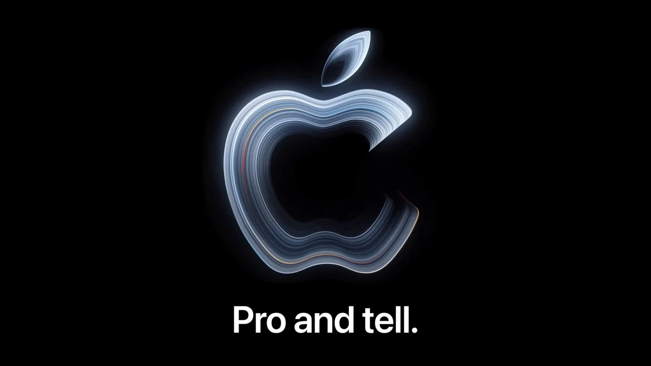 Apple-Logo in schimmerndem Silber auf schwarzem Grund, darunter der Schriftzug Pro and tell